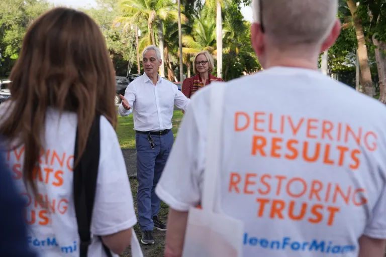 Rahm Emanuel, center, addresses supporters.