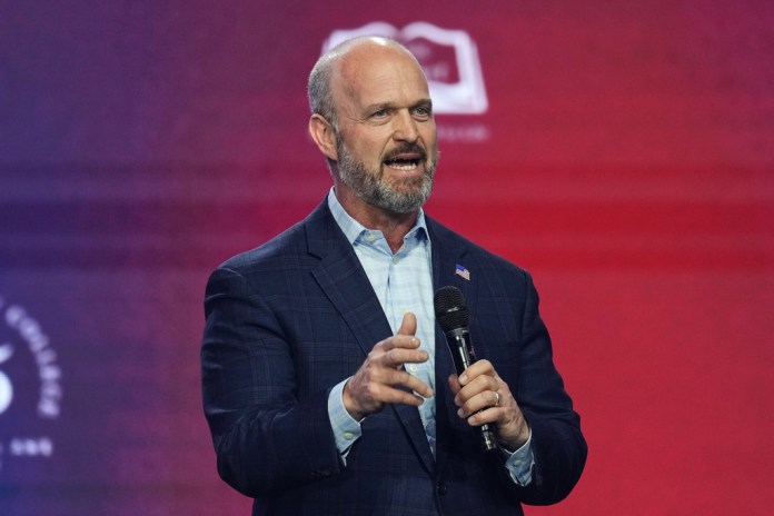 Kevin Roberts, president of The Heritage Foundation, speaks during Turning Point USA's AmericaFest 2025, Friday, Dec. 19, 2025, in Phoenix.