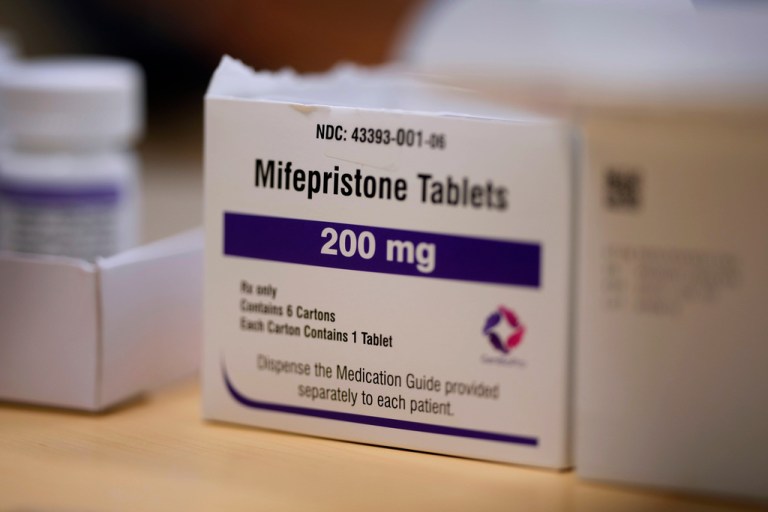 Mifepristone tablets sit on a table at a Planned Parenthood