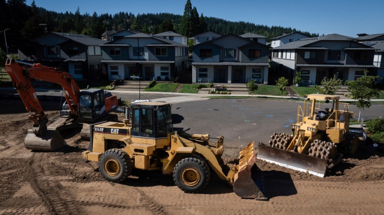 FILE - Construction equipment is seen near new homes on July 11, 2025, in Happy Valley.