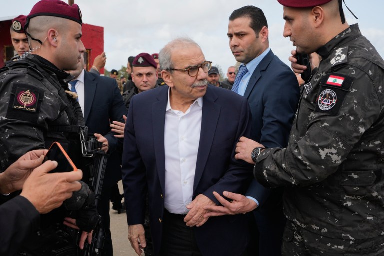 Lebanese Prime Minister Nawaf Salam, center, tours areas in southern Lebanon along the border with Israel that the Lebanese army says it has cleared of the armed presence of the militant Hezbollah group, in the village of Tayr Harfa, Saturday, Feb. 7, 2026. (AP Photo/Mohammed Zaatari)