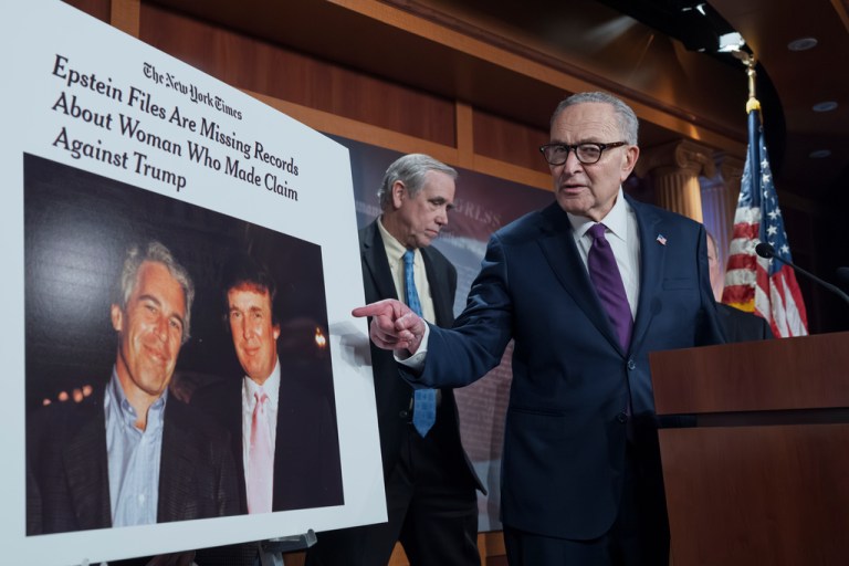 Chuck Schumer (D-NY) displays a photo of Jeffrey Epstein with Donald Trump