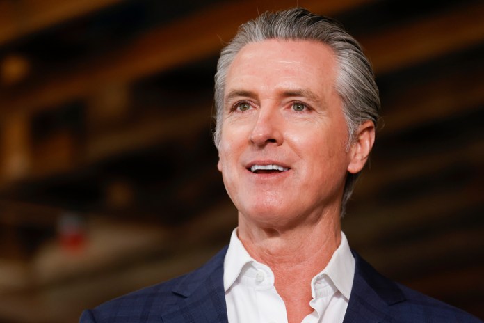 Governor Gavin Newsom speaks alongside local and state leaders during a press conference