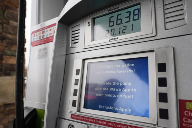 A running total is displayed as a person fills their vehicle with gas at a gas station in Baltimore, Wednesday, March 4, 2026. (AP Photo/Stephanie Scarbrough)
