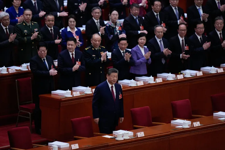 Xi stands in front of the National People's Congress