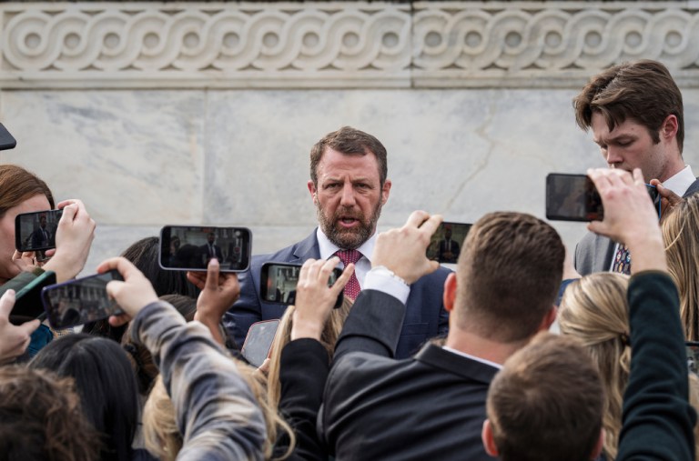 Sen. Markwayne Mullin, R-Okla., speaks with reporters on the steps at the Capitol