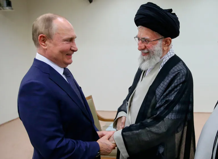 In this picture released by the official website of Iranian Supreme Leader Ayatollah Ali Khamenei, he and Russian President Vladimir Putin greet each other on July 19, 2022, during a meeting in Tehran, Iran.