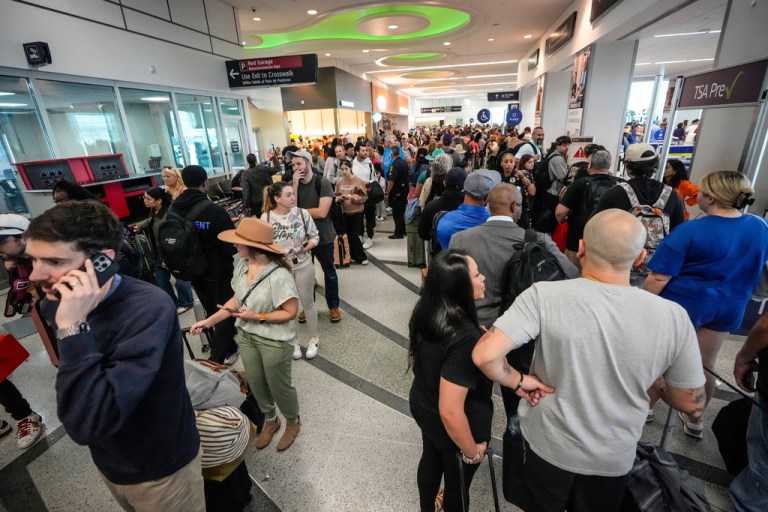 Airline passengers wait in long lines to get through the TSA security screening at William P. Hobby Airport in Houston, Sunday, March 8, 2026.