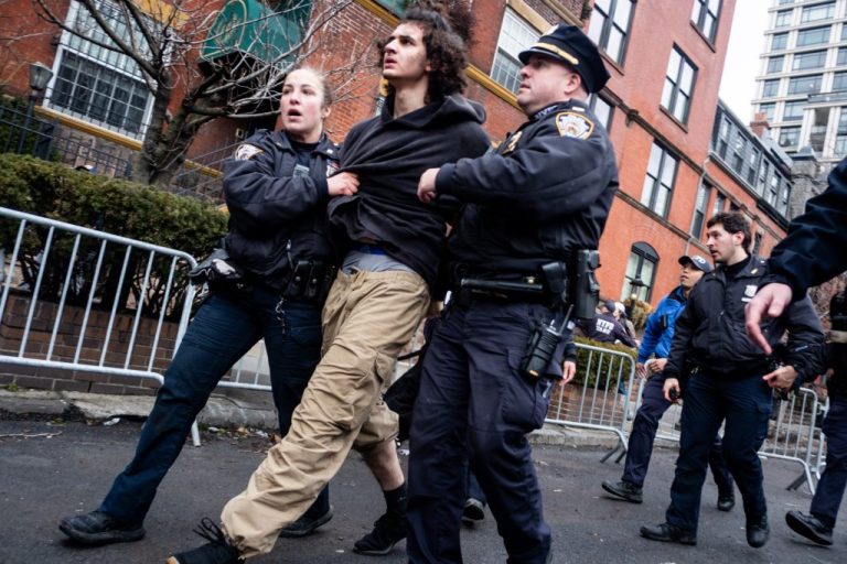 Police detain Emir Balat at Gracie Mansion in New York.