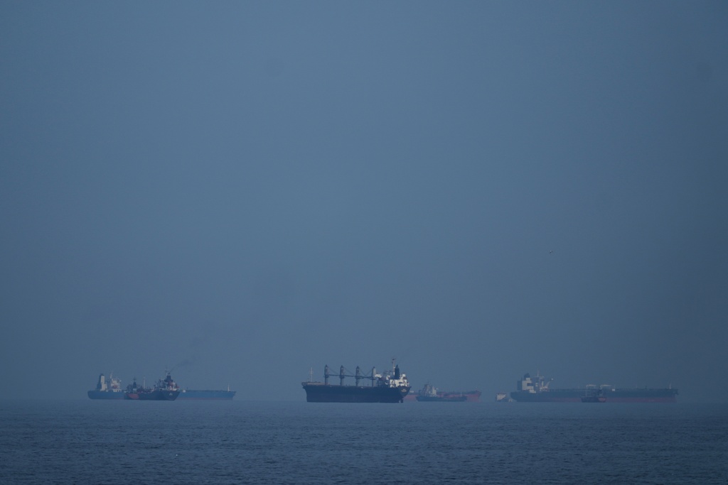 Three cargo ships damaged by projectiles in Strait of Hormuz