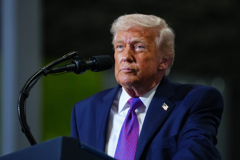 President Donald Trump standing at a podium