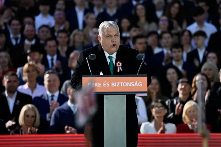Viktor Orban speaks from a podium