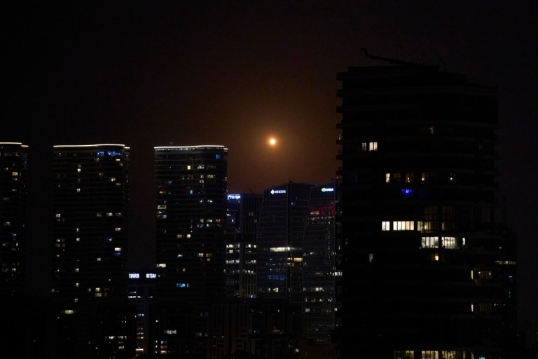 Missiles launched from Iran streak across the sky over central Israel