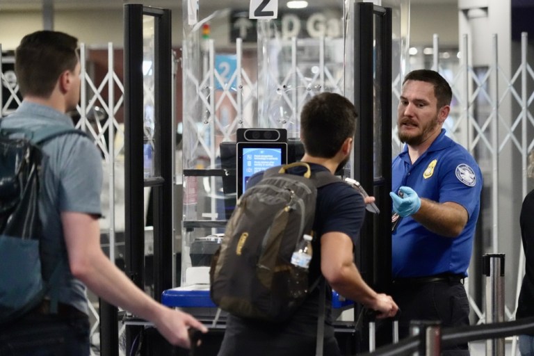 A TSA staff member at a check point at Harry Reid International Airport