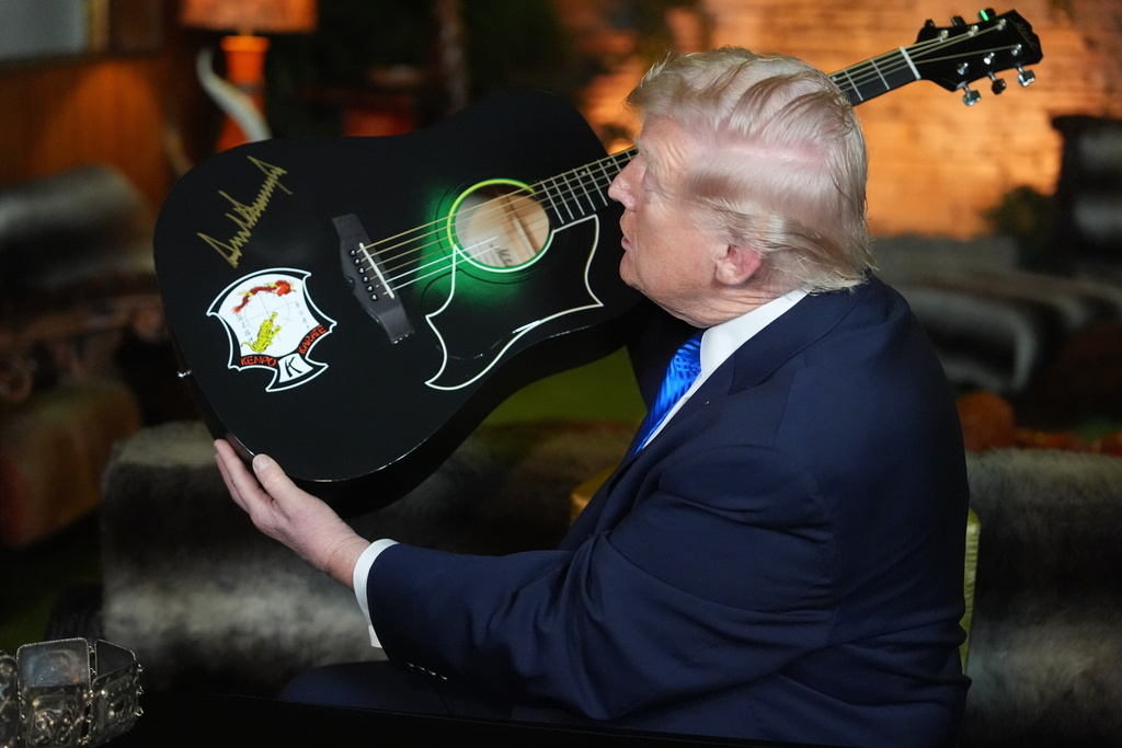 All shook up: Surreal scenes as Trump tours Graceland, musing if he could fight Elvis