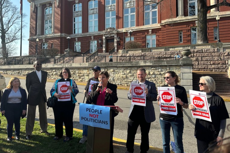 Suzanne Luther, the lead plaintiff in a lawsuit challenging Missouri's mid-decade congressional redistricting, speaks at a rally outside the Missouri Supreme Court building.
