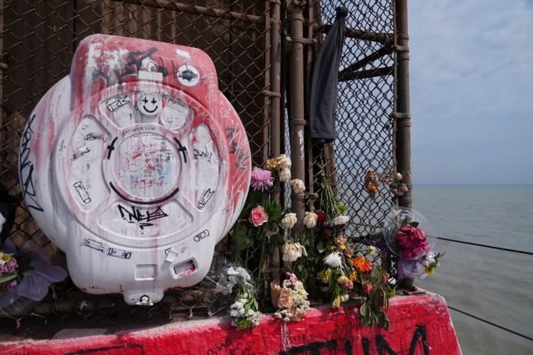 Flowers remain on the pier at Tobey Prinz Beach Park where 18-year-old Loyola University Chicago student Sheridan Gorman was shot and killed in the early morning hours of March 19, seen Wednesday, March 25, 2026, in Chicago.