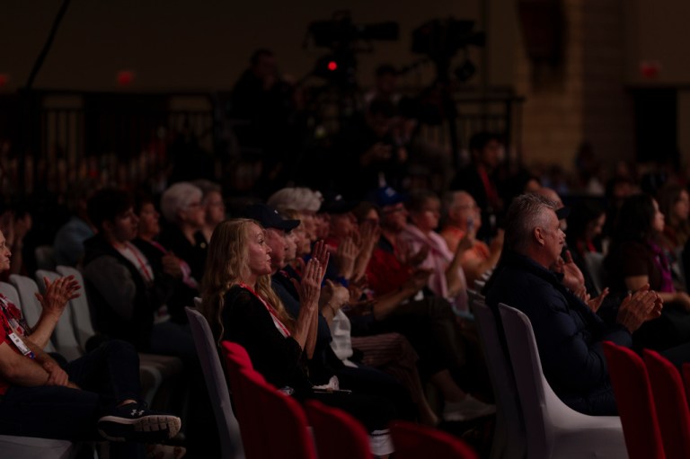 Audience members applauding during Jack Posobiec's speech honoring Charlie Kirk's memory at the Conservative Political Action Conference (CPAC) in Dallas, Friday, March 27, 2026. (AP Photo/Gabriela Passos)