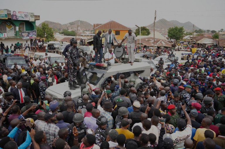 Caleb Mutfwang speaks to a crowd in Jos