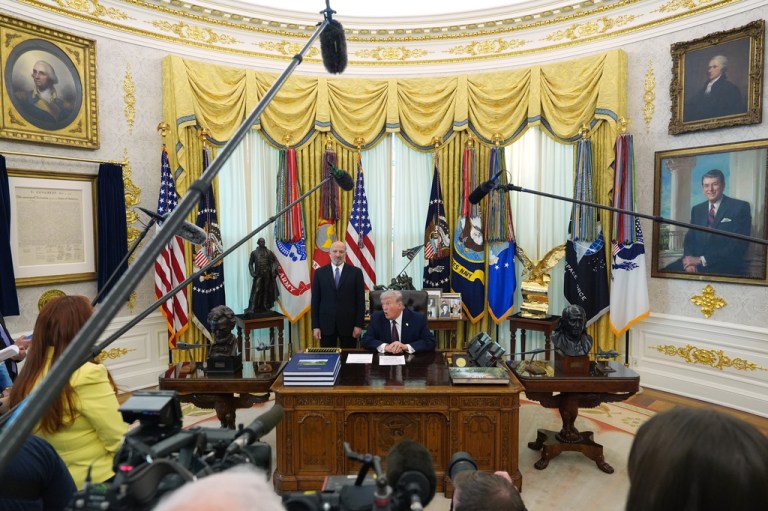 President Donald Trump answers questions from reporters after signing an executive order in the Oval Office of the White House Tuesday, March 31, 2026, in Washington, as Commerce Secretary Howard Lutnick listens. (AP Photo/Alex Brandon)