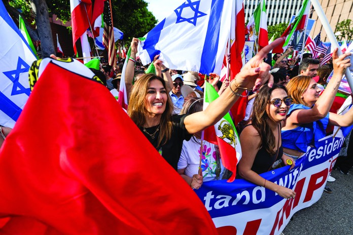A large crowd of demonstrators gather near the Federal Building in the Westwood area to celebrate and call for freedom for the Iranian people in the wake of U.S.-Israel attacks on Iran that killed Iran's Supreme Leader Ayatollah Ali Khamenei on March 1, 2026 in Los Angeles, California. (Photo by Qian Weizhong/VCG via Getty Images)