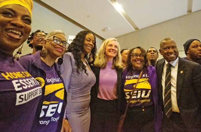 Gov. Abigail Spanberger (D-VA), center, poses while campaigning with members of the public-sector Service Employees International Union (SEIU) in Richmond, Virginia, April 8, 2025. (Max Posner/Washington Post/Getty)
