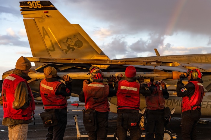 This image provided by U.S. Central Command shows Navy sailors attaching ordnance onto an F/A-18E Super Hornet aircraft on the USS Gerald R. Ford (CVN 78) in support of Operation Epic Fury, on Saturday, Feb. 28, 2026. (U.S. Navy via AP)