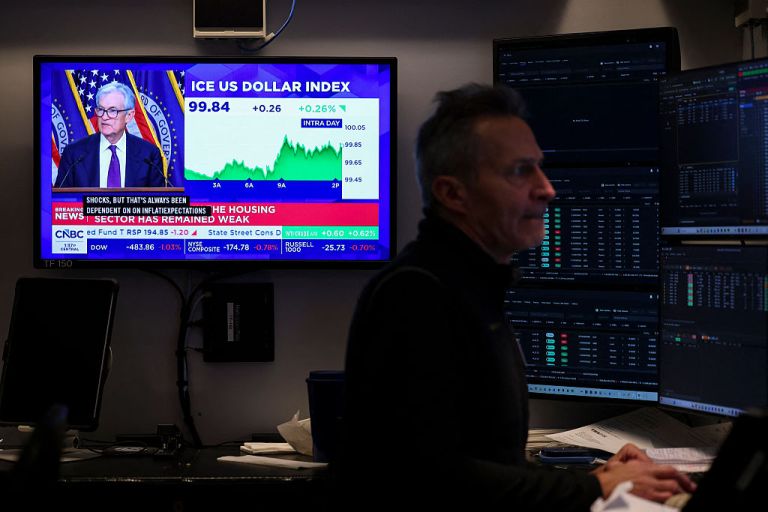 A livestream shows Jerome Powell, chairman of the US Federal Reserve, speaking after a Federal Open Market Committee (FOMC) meeting on the floor of the New York Stock Exchange (NYSE) in New York on March 18, 2026. The US Federal Reserve kept interest rates unchanged Wednesday as expected, in defiance of President Donald Trump as the world's largest economy battles stubborn inflation, weak labor demand and an 