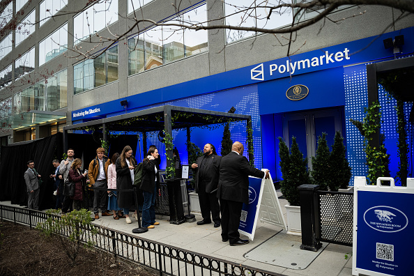 Attendees wait in line outside the Situation Room by Polymarket pop-up bar in Washington, D.C.