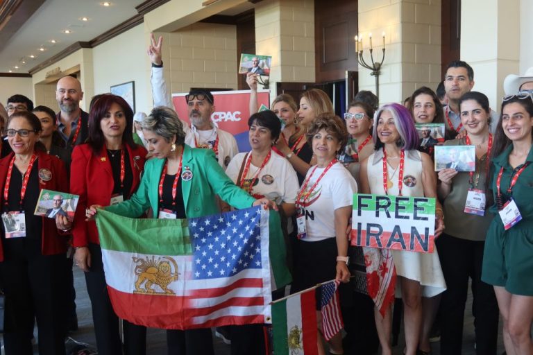 Iranian American attendees gather outside the main stage at CPAC.