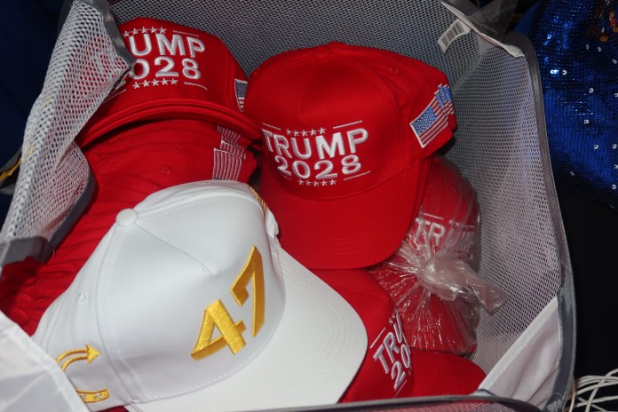 
Sandy Schoepke, a conservative merchandise vendor, offers clients Trump 2028 hats for fre if they purchase two hats or spend $50. (Samantha-Jo Roth, Washington Examiner)
