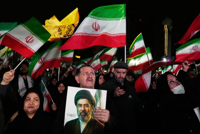 Pro-government supporters during a rally in a square in western Tehran
