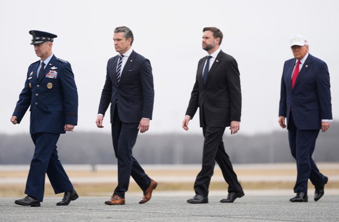 From left, Chairman of the Joint Chiefs of Staff Gen. Dan Caine, Defense Secretary Pete Hegseth, Vice President JD Vance and President Donald Trump attend a casualty return for the soldiers who were killed in a drone strike at a command center in Kuwait after the U.S. and Israel launched its military campaign against Iran at Dover Air Force Base, Delaware on March 7. (Mark Schiefelbein/AP)