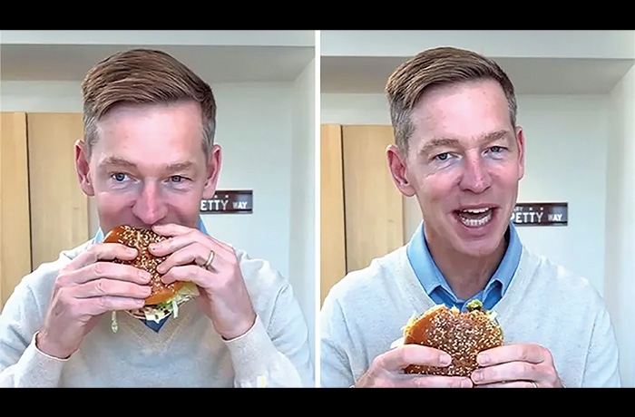 McDonald’s CEO Chris Kempczinski takes a bite out of the new Big Arch sandwich in a now-viral clip. (Courtesy of McDonald’s)