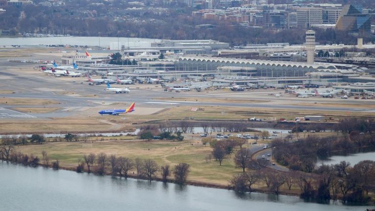 A Southwest airlines plane wait on the taxiway at Ronald Reagan Washington National Airport (DCA), which is located along the Potomac River, in Arlington, Va., Tuesday, Dec., 9, 2025. (AP Photo/Pablo Martinez Monsivais)