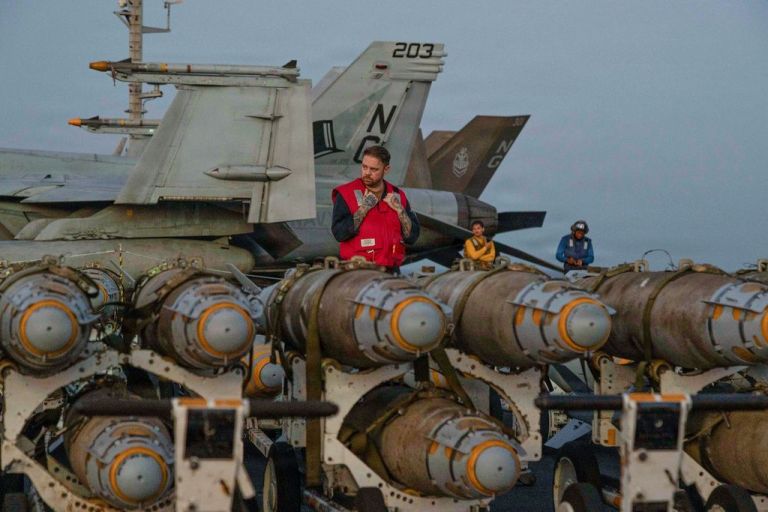 Sailors aboard aircraft carrier.