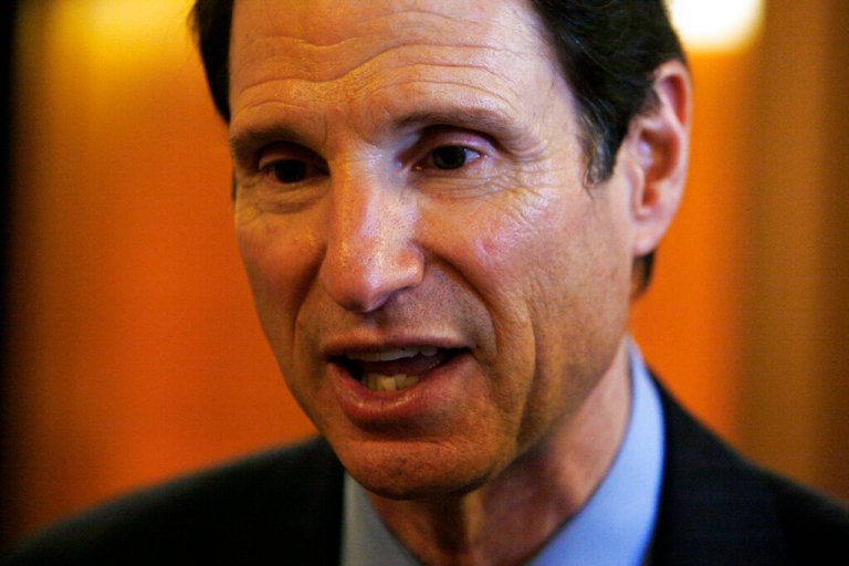 Sen. Ron Wyden, D-Ore. speaks to reporters on Capitol Hill in Washington, Wednesday, Oct. 14, 2009. (AP Photo/Charles Dharapak)