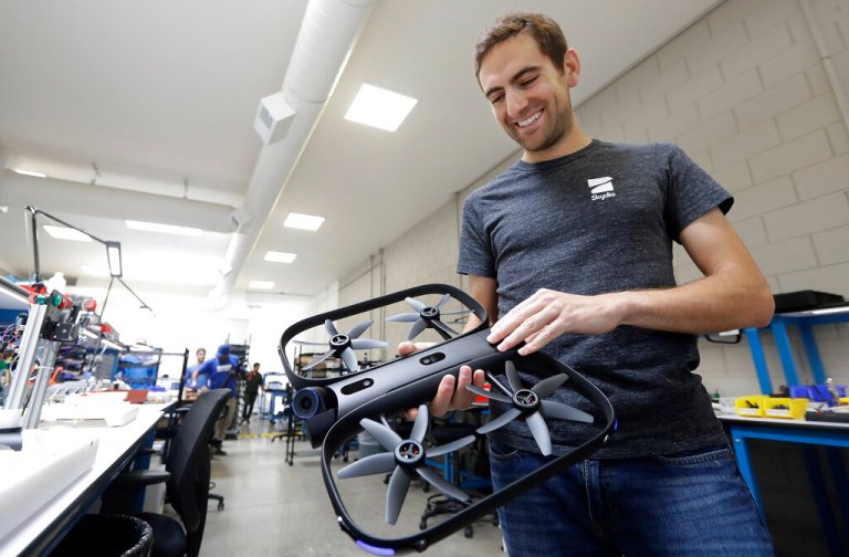 Skydio CEO Adam Bry holding a drone