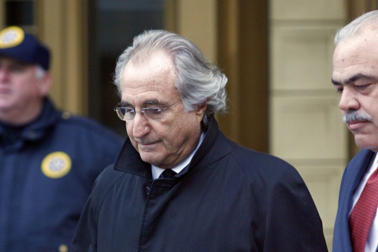 FILE - In this Jan. 14, 2009 file photo, Bernie Madoff leaves Federal Court in New York. Madoff, the financier who pleaded guilty to orchestrating the largest Ponzi scheme in history, died early Wednesday, April 14, 2021, in a federal prison, a person familiar with the matter told The Associated Press. ( AP Photo/Stuart Ramson, File