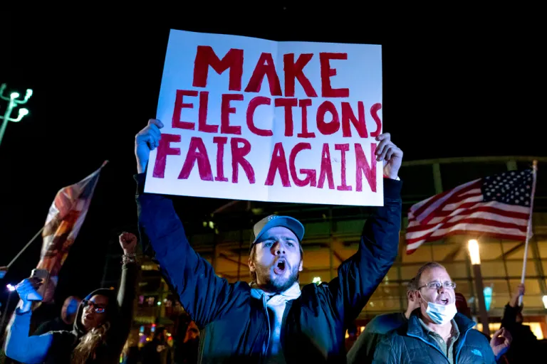 Jake Contos, a supporter of President Donald Trump, chants during a protest against the election results outside the central counting board at the TCF Center in Detroit.