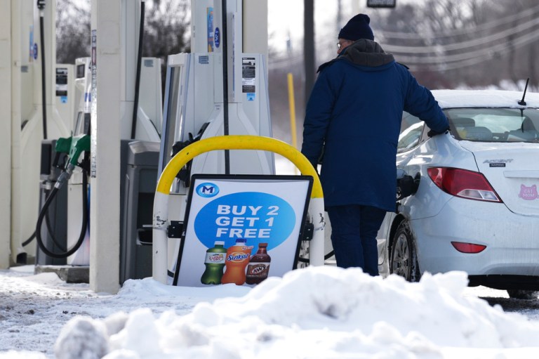 FILE - A customer pumps gas at a gas station in Wheeling, Ill., Jan. 19, 2024. On Friday, Feb. 16, 2024, the University of Michigan releases its preliminary reading of consumer sentiment for February.
