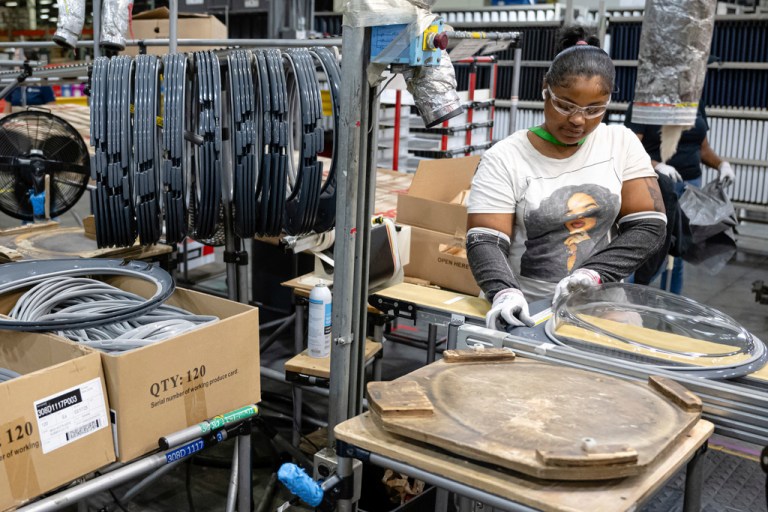 An employee pieces together components on an assembly line at GE Appliances global headquarters, Wednesday, Aug 13, 2025, in Louisville, Ky.