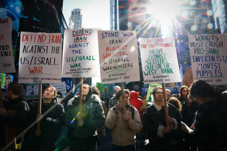 People protest against U.S. and Israeli strikes on Iran in New York.