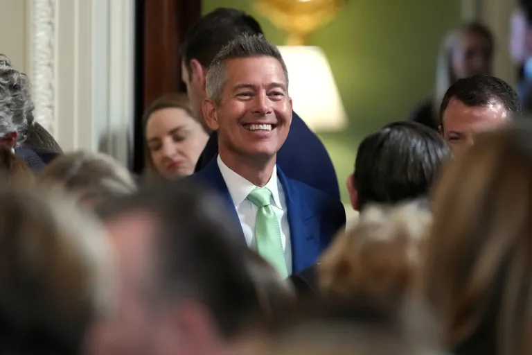 Transportation Secretary Sean Duffy arrives before Ireland's Prime Minister Micheál Martin presents President Donald Trump with a bowl of shamrocks during a St. Patrick's Day event in the East Room of the White House, Tuesday, March 17, 2026, in Washington. (AP Photo/Julia Demaree Nikhinson)