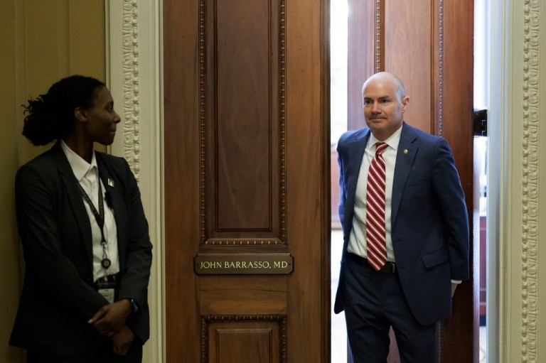Sen. Mike Lee, R-Utah, exits the office of Senate Majority Whip John Barrasso, R-Wyo., following a meeting on Capitol Hill on Saturday, March 21, 2026, in Washington. (AP Photo/Tom Brenner)