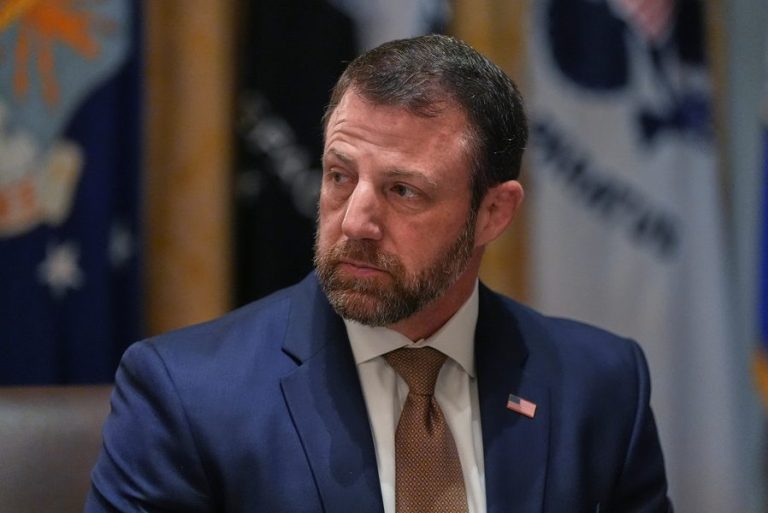 Homeland Security Secretary Markwayne Mullin listens during a Cabinet meeting at the White House, Thursday, March 26, 2026, in Washington. (AP Photo/Alex Brandon)