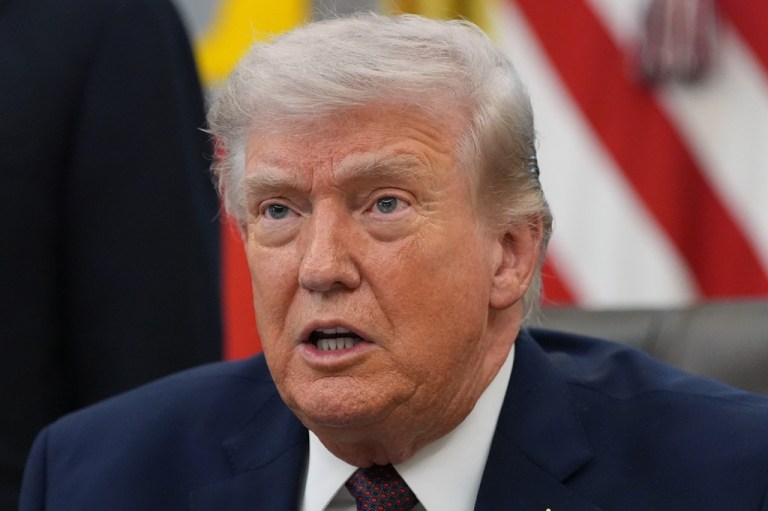 Trump speaks to reporters at the Oval Office