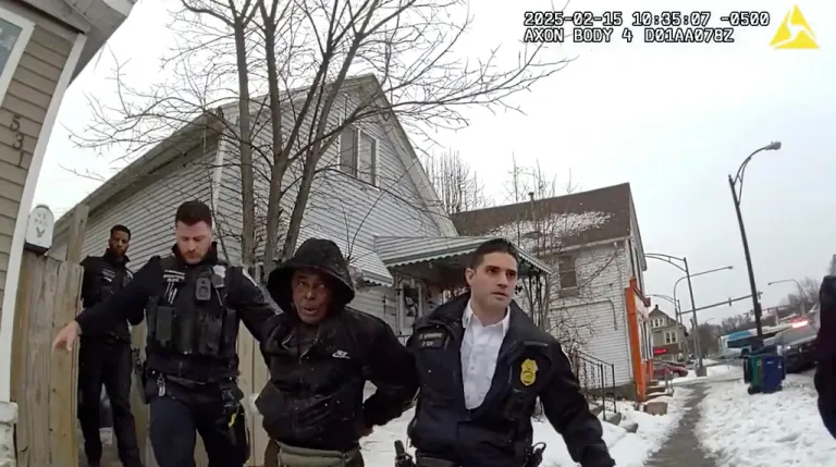 This image from body camera video provided by the Buffalo Police Department shows Nurul Amin Shah Alam, center, led by Buffalo Police officers, Feb. 15, 2025, in Buffalo, N.Y.