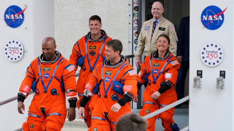 Astronauts, from left, pilot Victor Glover, Canadian Space Agency astronaut Jeremy Hansen, commander Reid Wiseman and mission specialist, Christina Koch leave the Operations and Checkout building on their way to Launch Pad 39B for a planned liftoff on NASA's Artemis II moon rocket at the Kennedy Space Center, Wednesday, April 1, 2026, in Cape Canaveral, Fla. (AP Photo/John Raoux)