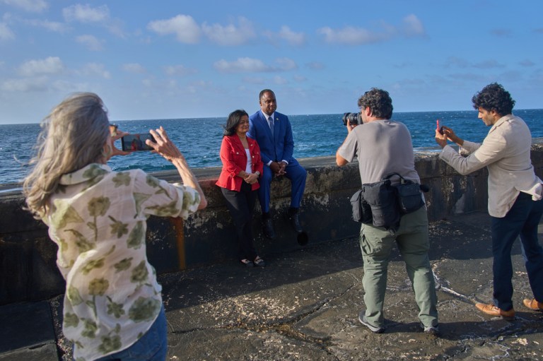U.S. lawmakers Pramila Jayapal, D-Wash., center left, and Jonathan Jackson, D-Ill., pose for photojournalists at the Malecon in Havana.